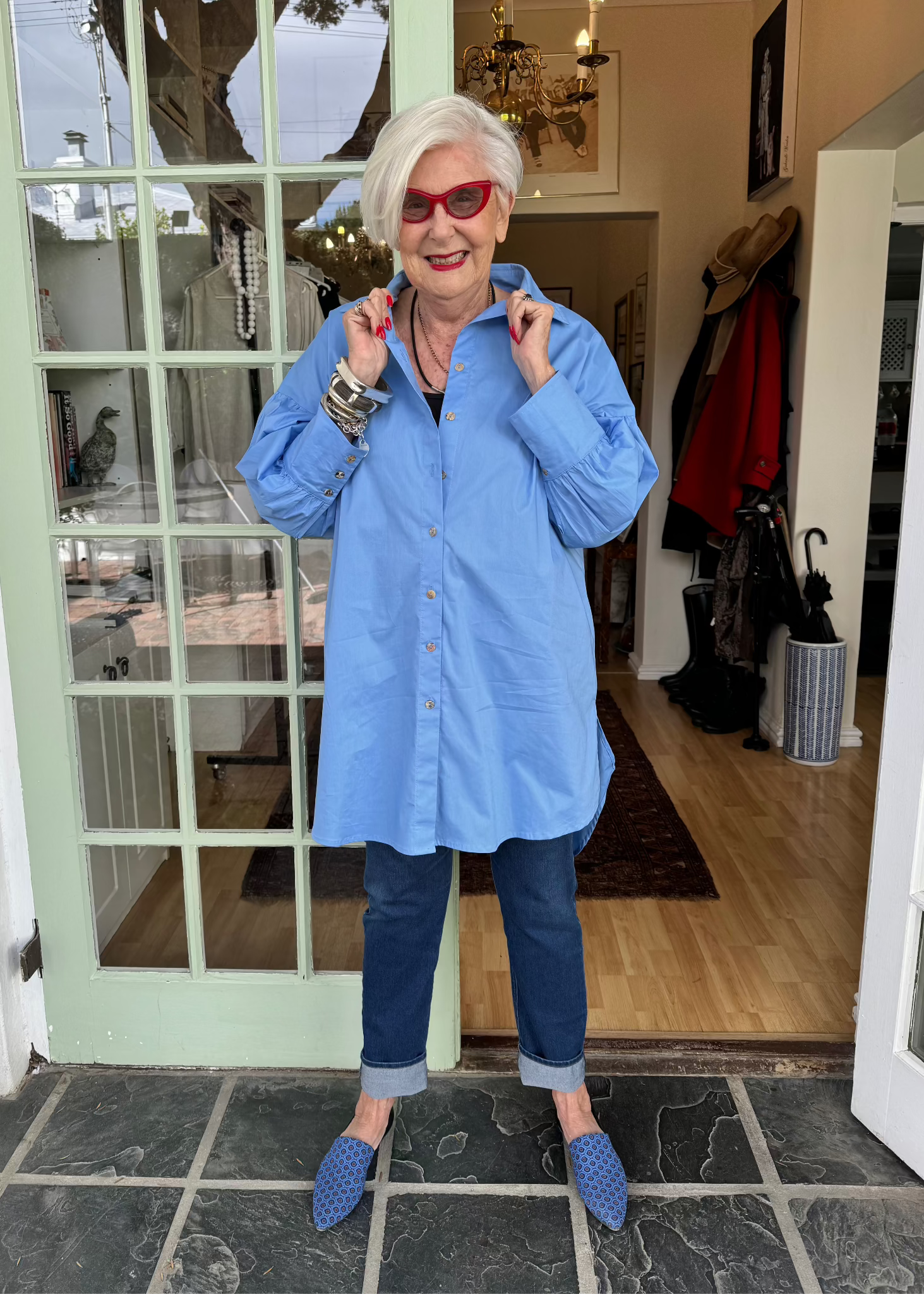 Jenny le Roux wearing a blue 100% cotton shirt, with a hint of a puff sleeve.