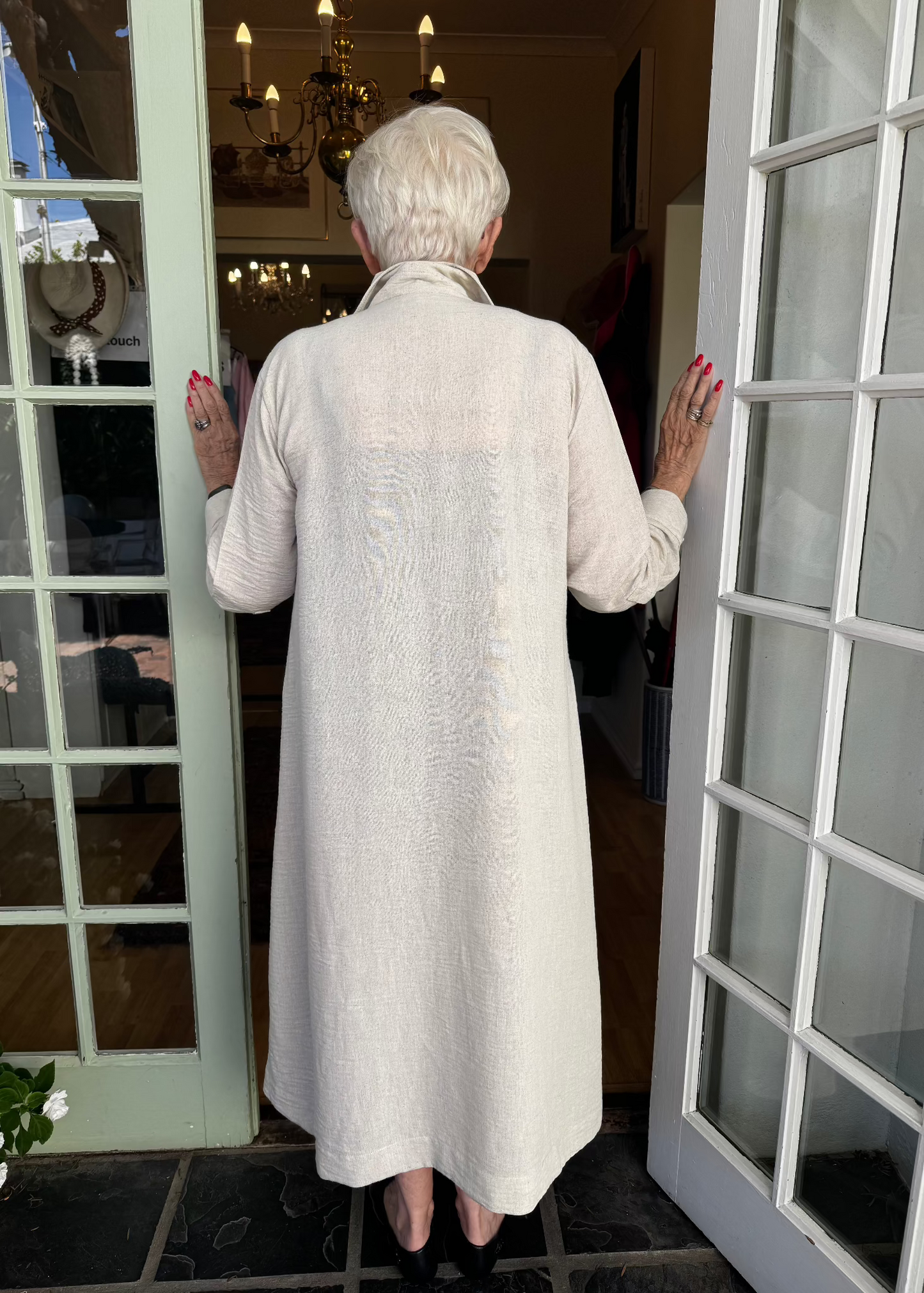 The Linen Pintuck Dress really can be worn in all seasons. It can be worn open as a coat, has side pockets with a two button cuff sleeve. Made from a linen blend which is a natural fabric.