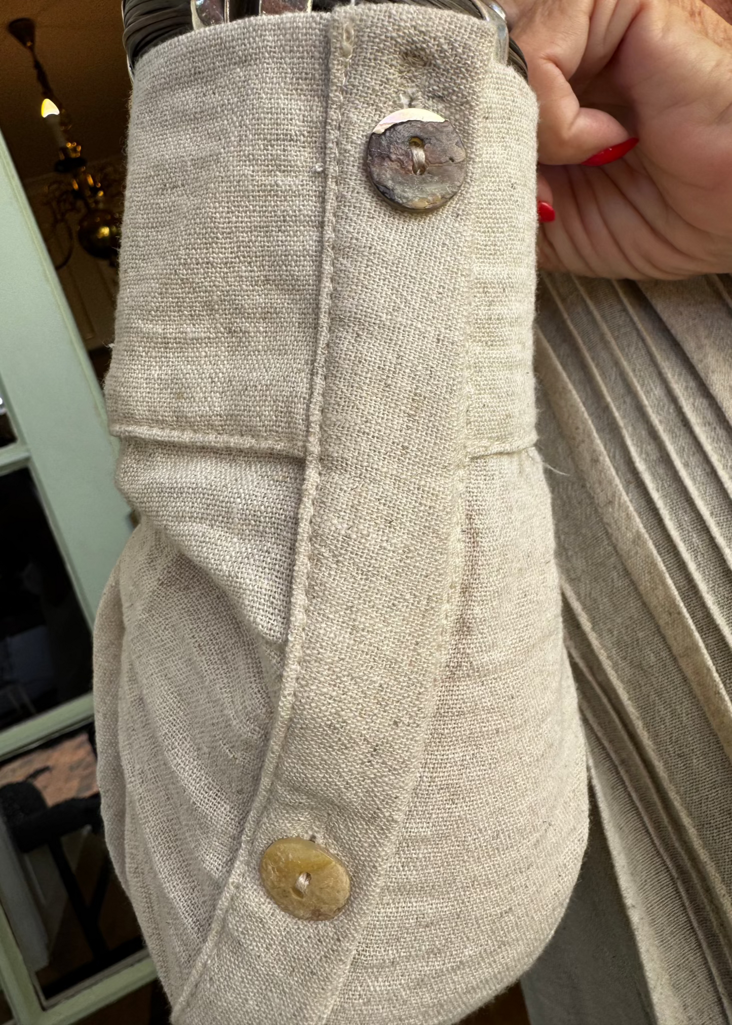 The Linen Pintuck Dress really can be worn in all seasons. It can be worn open as a coat, has side pockets with a two button cuff sleeve. Made from a linen blend which is a natural fabric.