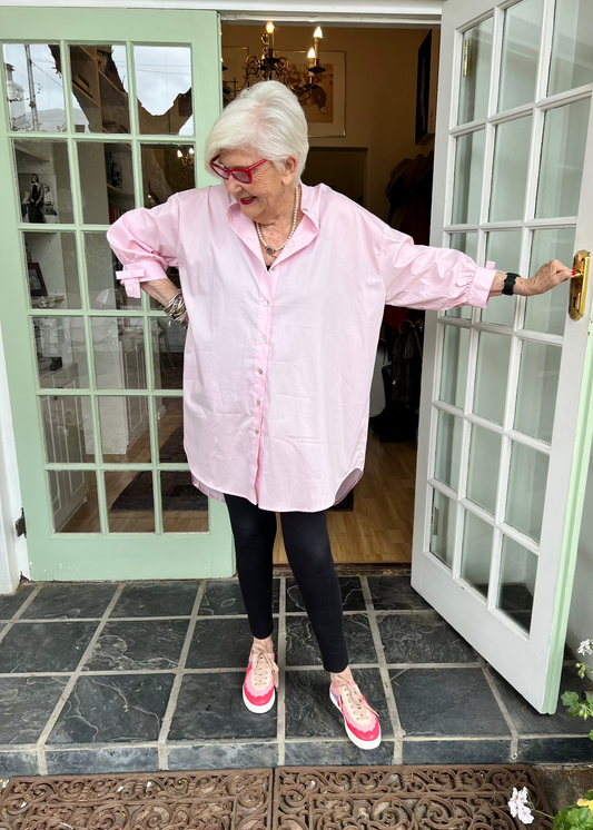 100% crisp cotton poplin women's shirt featuring dramatic back pleat with tied bow and decorative bow cuffs.