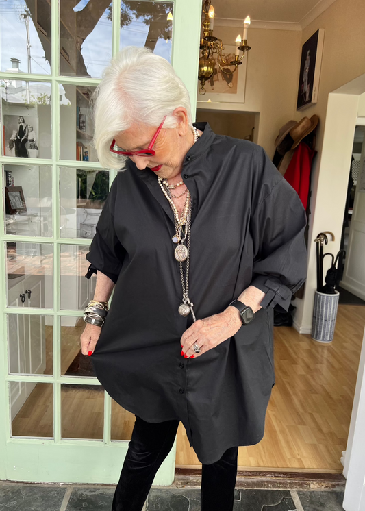 100% crisp cotton poplin women's shirt featuring dramatic back pleat with tied bow and decorative bow cuffs.