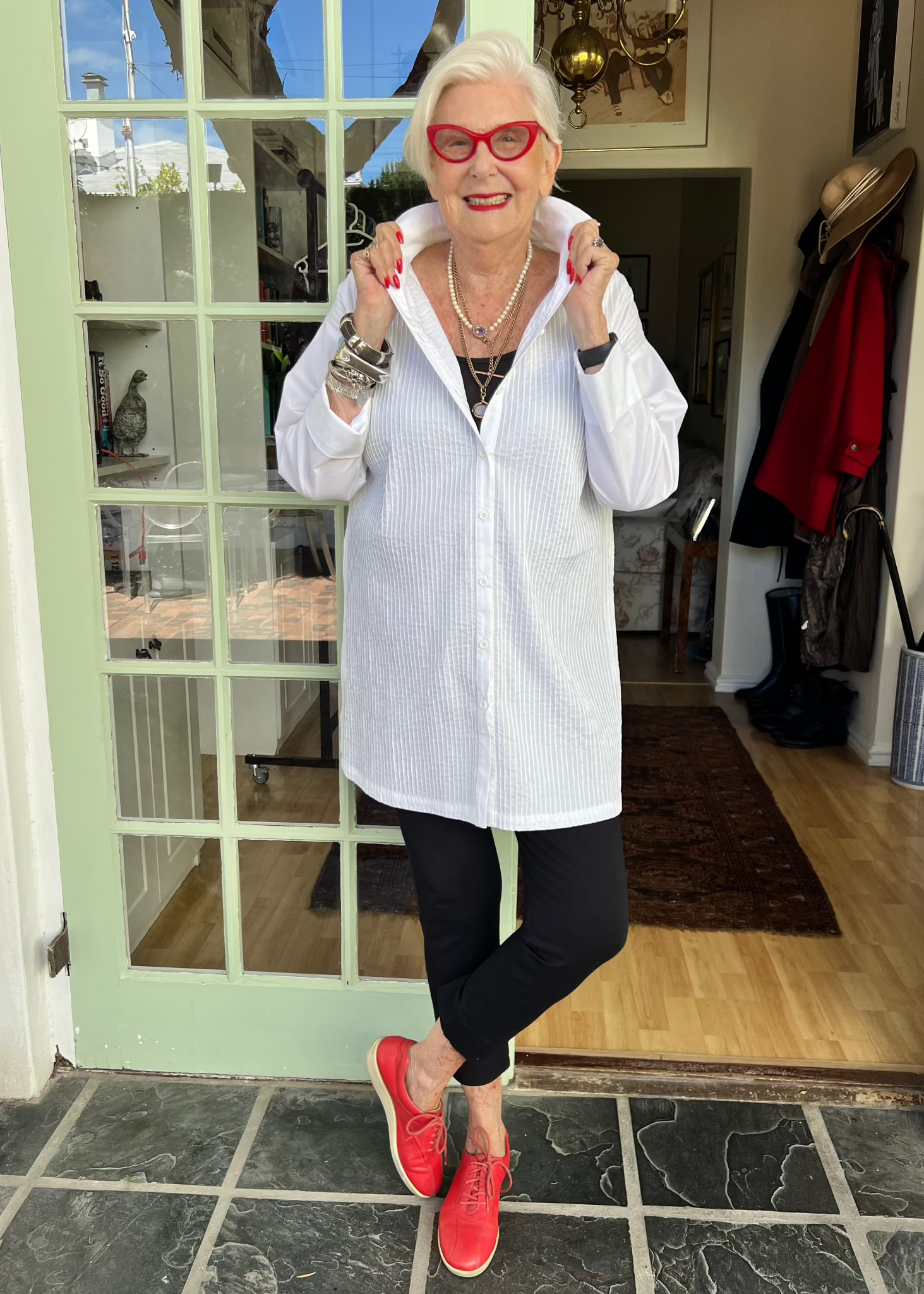 Crafted from crisp cotton with intricate pleating at the front and a sleek plain back, this exceptionally designed shirt offers the perfect balance of structure and flow. The elongated silhouette gracefully skims the body, providing an effortlessly slimming effect, while its generous length allows it to double as a lightweight jacket when left unbuttoned.