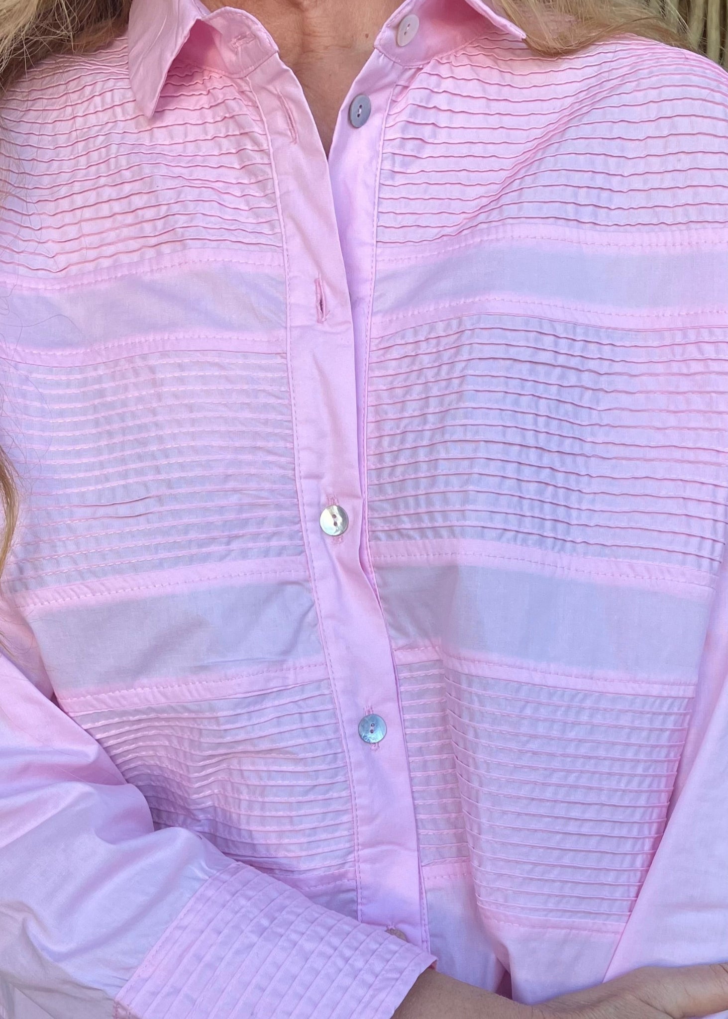 Crafted from luxurious 100% pure cotton, this architectural shirt elevates everyday dressing with its striking interplay of pleated and smooth panels – a sophisticated technique that creates depth, movement, and exceptional breathability.