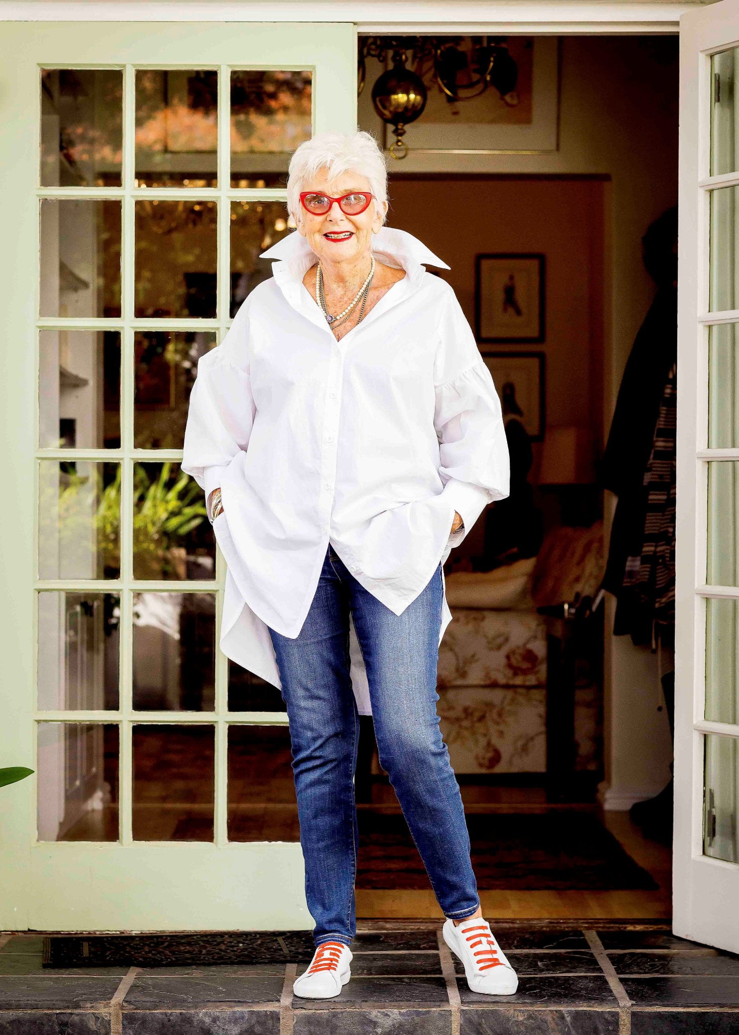 Jenny le Roux wearing a crisp white 100% cotton shirt, with a hint of a puff sleeve.