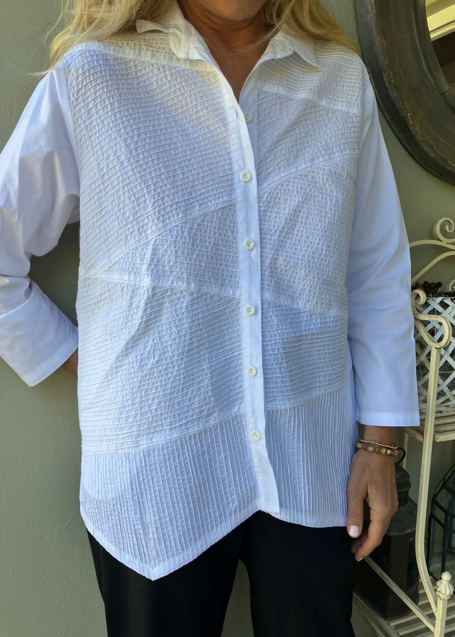 Meticulously constructed from pure cotton, this striking shirt features ten precisely measured pleated sections in the front, creating a dynamic play of texture and movement. The extraordinary craftsmanship behind each perfectly aligned fold requires hours of skilled handwork β a labor of love that justifies its premium price point.