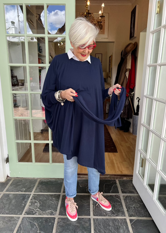 If there's one sentence I really love it's "One size fits all". And that's just what this is. A cosy, comfy throw-on top that works for all sizes. Rayon with a bit of Poly to keep its shape. Tight stretchy cuffs so you can push up and they stay up. Can be worn with a shirt underneath, comes with a scarf.